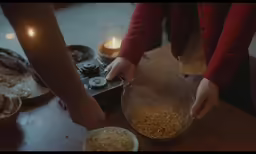 hands that are holding some food together
