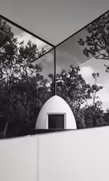 a mirror reflecting the trees in the distance