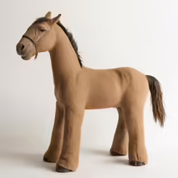 a toy horse made from brown wool and fabric