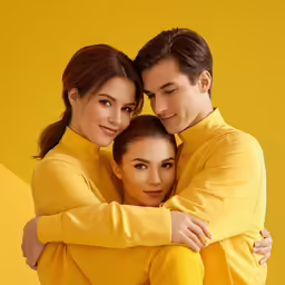 a woman with her arm around a man with his arms over the shoulders
