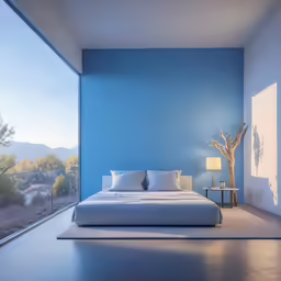 a blue bedroom that is very clean and is empty