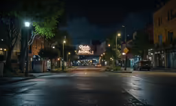 the street is deserted at night with a bus traveling in