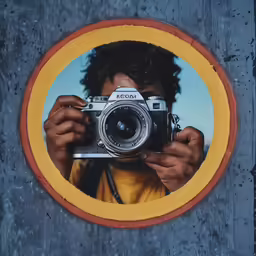 a photo taken through an oval hole on a wall