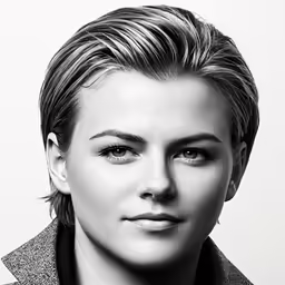 an attractive young woman wearing a black tie
