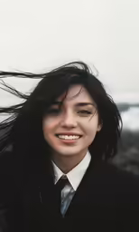 a woman in business suit with very long hair