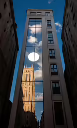 buildings reflected on a large windows in a building