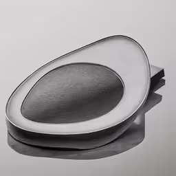 a gray ring sits atop a white surface