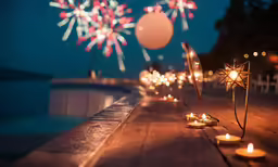 some white fire hydrants and some candles on a wooden surface