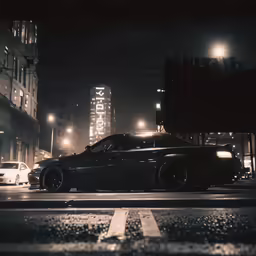 a night view of the city street in front of a large building