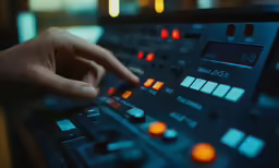 someone is holding the buttons on an electronic device