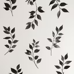 several black and white leaves on a wall