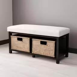 the storage bench has two wicker baskets underneath it
