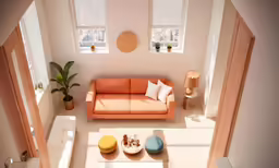 a room with a couch, coffee table and potted plants
