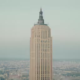 the top of a building with a steeple on top