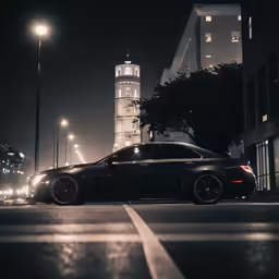 a car driving down the street at night