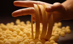 there are several yellow candies being made