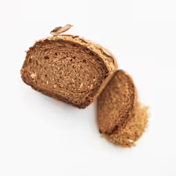 a loaf of bread sitting on top of a white table
