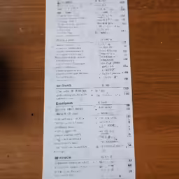 a paper with a lot of black text on it