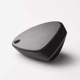 a black object sitting on top of a white surface