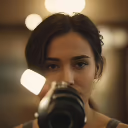 a woman with a camera taking a photo