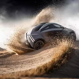 a gray sports car in a deep, muddy area
