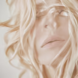 blond woman with eyes closed with long hair