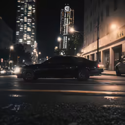 a dark city street with a few cars