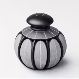 the vase is shaped like an urn with a black top