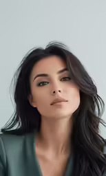 a close up shot of a woman with brown hair and eyes closed