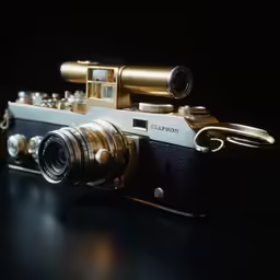 an antique camera with a gold lens and two lenses