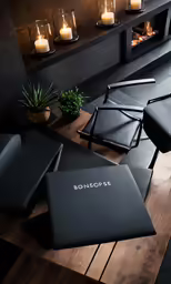 three empty laptop computers and candles in the background