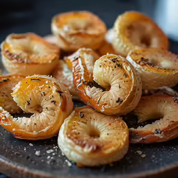 some onion rings are placed on a plate