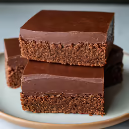 three slices of chocolate cake on a white plate