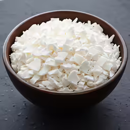 a bowl of marshmallows with lots of white powder in it