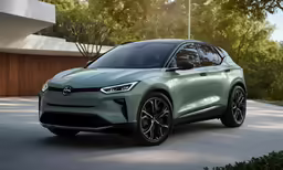 the all electric toyota kakaota suv parked in front of a house