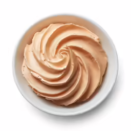 a bowl of food with cream on it