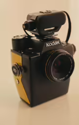 a camera and a microphone with some type of phone on it