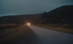 two lights are shining in the middle of the road