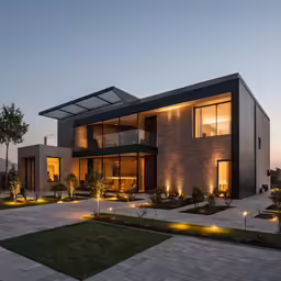a modern house with an expansive backyard at night