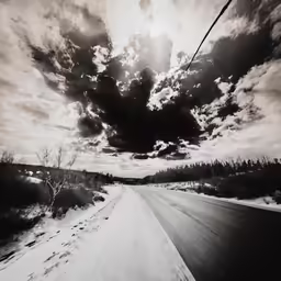 this is a black and white photo of a cloudy sky