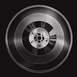 a black and white photo of a wheel with spokes