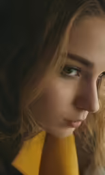 a young woman is looking at the camera