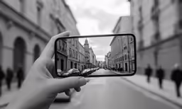 someone is taking a photo while they travel down a street