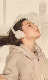 a woman in an earphones looks up at the sky