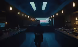 a man in a dark room standing