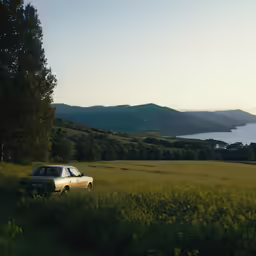 an old car parked out in a field