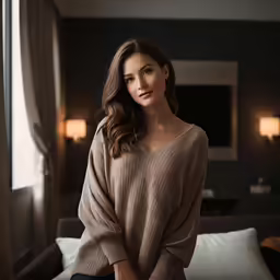 a woman standing in a hotel room wearing an off the shoulder sweater