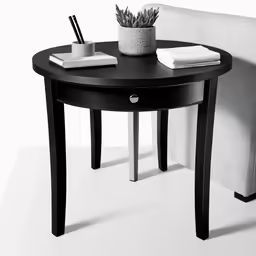 a small black table with two drawers and a pen holder