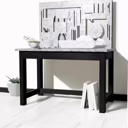a table with books and a vase on it
