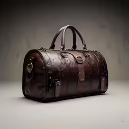 a brown leather bag on a white surface